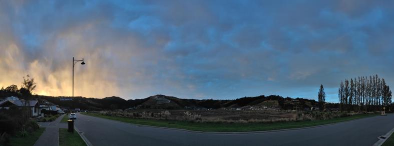Panorama of a stunning sunrise through classic nor-west cloud over the Port hills at the top of our valley.
